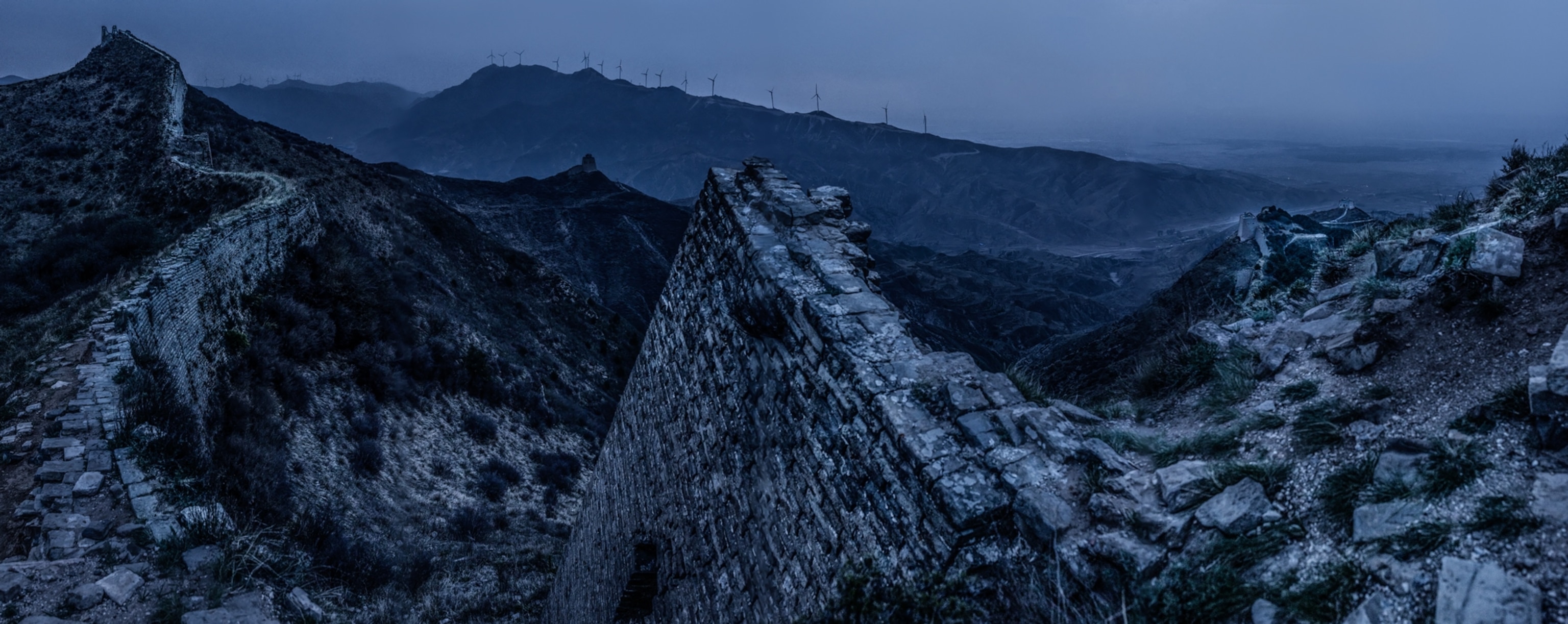 a portion of the great wall of china at dusk