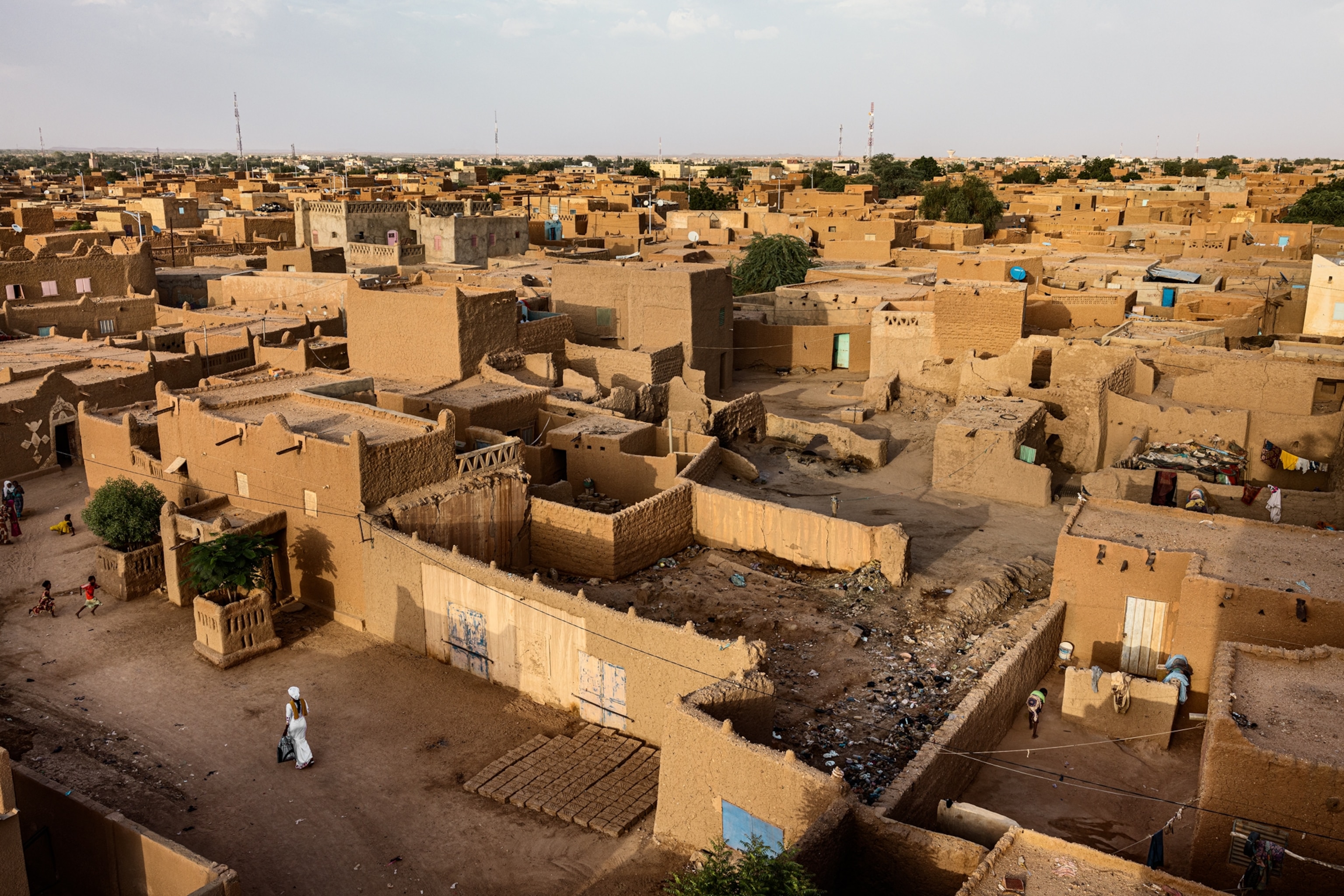 aerial of city buildings that are three stories tall and made of mudbrick