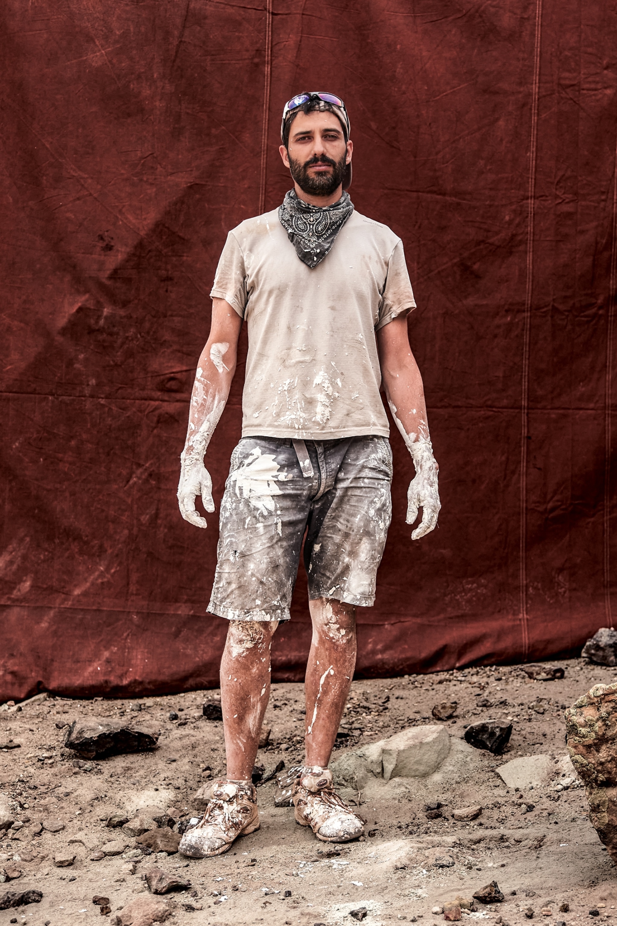 Sauropod dinosaur expert covered in plaster.